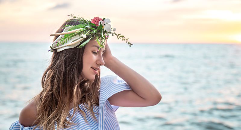 portrait-young-woman-with-composition-flowers-her-head-against-background-ocean-sunset.jpg